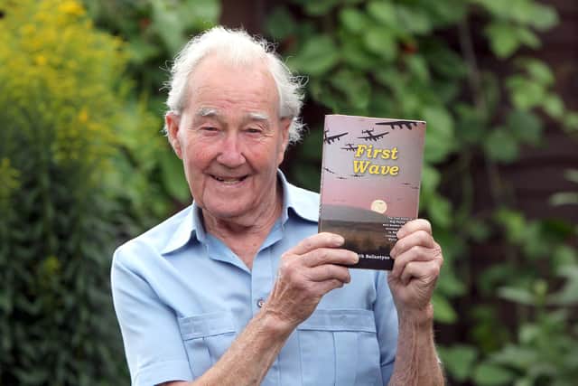 Reg Payne with his book First Wave