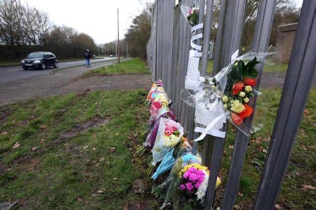 Flowers left at the scene of the crash in 2015.