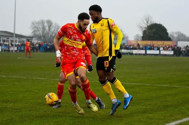 AJ George challenges for the ball with former Diamonds midfielder Jay Williams. Picture courtesy of Hawkins Images