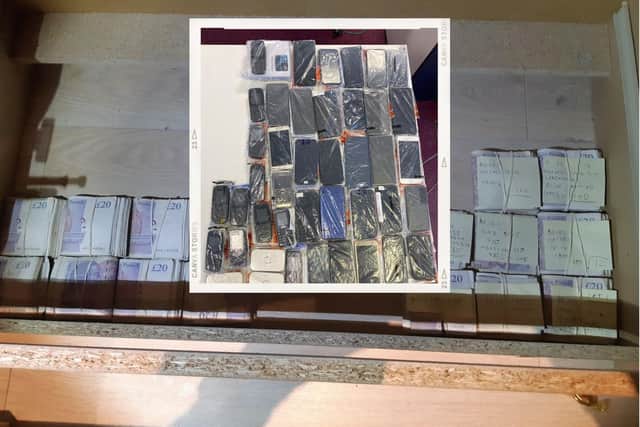 Some of the cash seized and (inset) the phones discovered during the raids