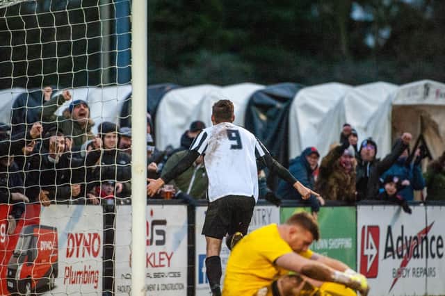 Elliot Sandy heads off to celebrate after scoring Corby Town's third goal in their 3-0 win over Coleshill Town. Pictures by Jim Darrah