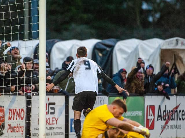 Elliot Sandy heads off to celebrate after scoring Corby Town's third goal in their 3-0 win over Coleshill Town. Pictures by Jim Darrah