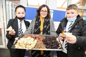 Carly Waterman with assorted savoury treats including haggis, square sausage and black pudding