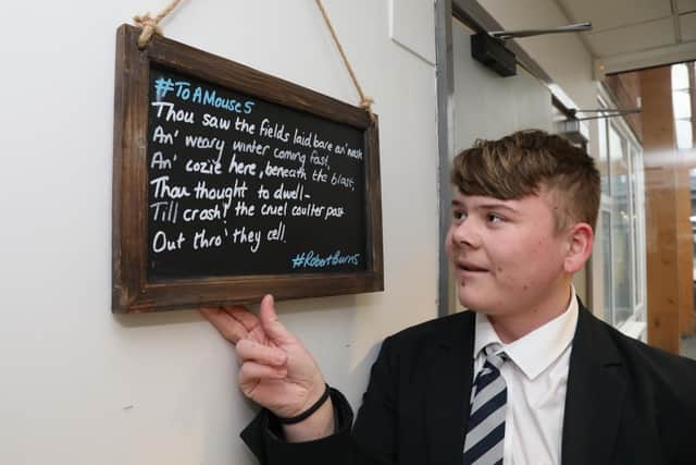 Students can read poems on chalkboards around the school - Kayden Smith, 14, reads Ode to a Mouse