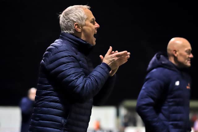 Ian Culverhouse encourages his team from the sidelines during his first game in charge of Kettering Town. Picture by Peter Short