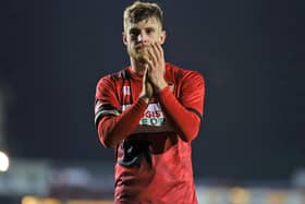 Kettering Town captain Connor Kennedy applauds the fans following Tuesday's 1-0 defeat to Kidderminster Harriers, which was Ian Culverhouse's first game in charge of the club. Picture by Peter Short