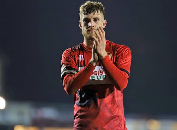 Kettering Town captain Connor Kennedy applauds the fans following Tuesday's 1-0 defeat to Kidderminster Harriers, which was Ian Culverhouse's first game in charge of the club. Picture by Peter Short