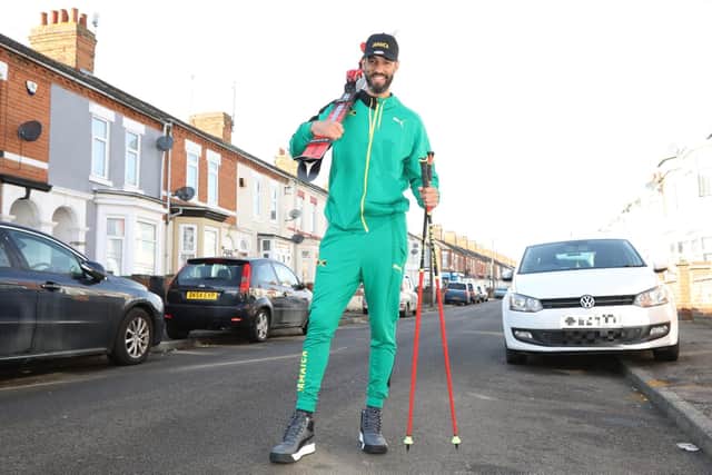 Benjamin Alexander in his home town sporting his new Jamaican tracksuit ready for the Winter Olympics
