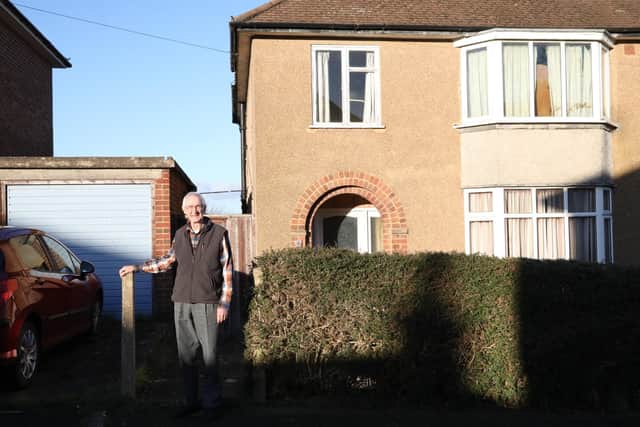 Tony Glynn outside the house that has been left empty for nearly 20 years