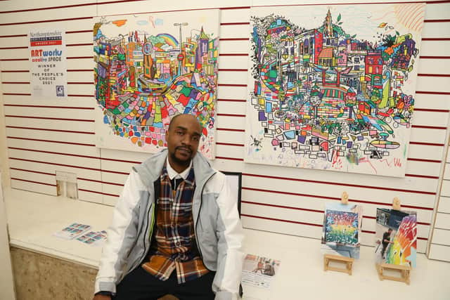 Marvin Mudzongo with his colourful canvases