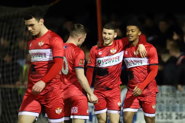 Decarrey Sheriff takes the congratulations after his second goal