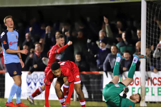 Decarrey Sheriff heads off to celebrate after he scored the second of his two goals in Kettering Town's 2-1 success over Southport. Pictures by Peter Short