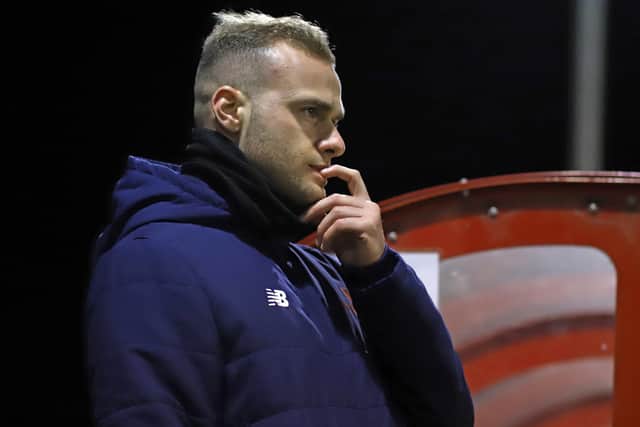 New first-team coach Joe Simpson watches on from the sidelines at Latimer Park