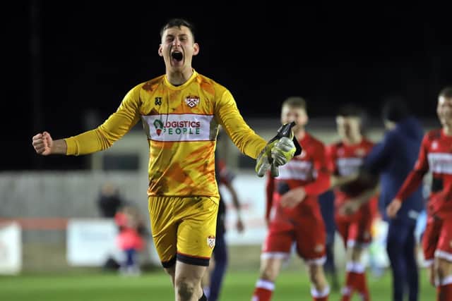 Poppies goalkeeper Jackson Smith shows his delight at the final whistle