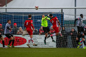 Corby Town goalkeeper Ben Heath punches the ball clear during the 2-0 defeat to Ilkeston Town. Picture by Jim Darrah