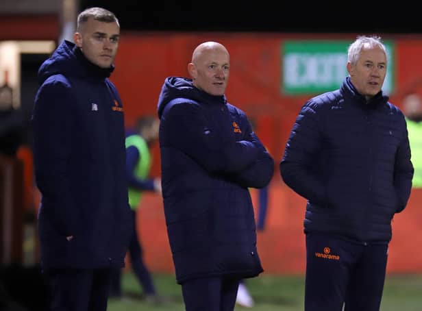 Ian Culverhouse (right) watches on during Kettering Town's 0-0 draw at Alfreton Town with first-team coach Joe Simpson (left) and assistant-manager Paul Bastock. Picture by Peter Short