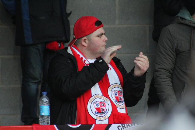 A Reds fan applauds. Crawley Town v Hartlepool United. Picture by Cory Pickford SUS-221202-205643004