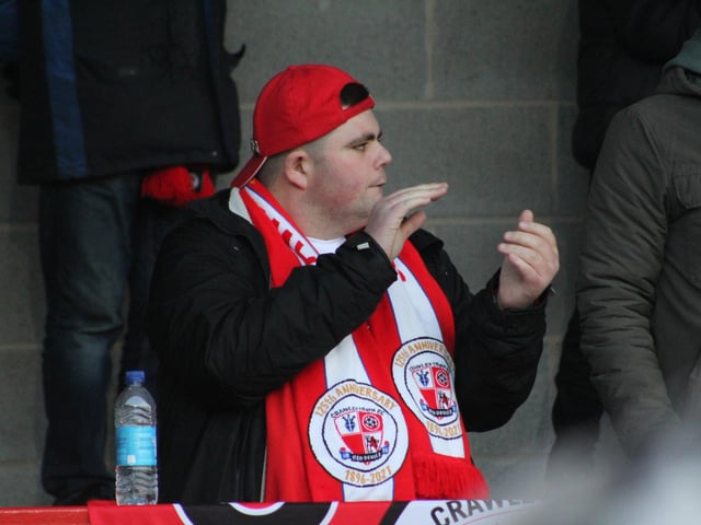 A Reds fan applauds. Crawley Town v Hartlepool United. Picture by Cory Pickford SUS-221202-205643004