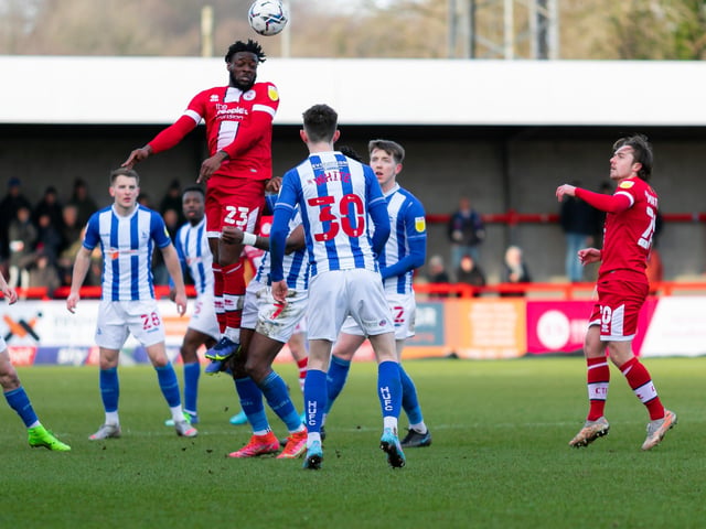 Remi Oteh rises highest. Crawley Town v Hartlepool United. Pictures by Jamie Evans UK Sports Images SUS-221202-211416004