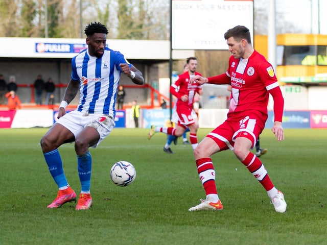 Jordan Tunnicliffe challenges Omar Bogle. Crawley Town v Hartlepool United. Pictures by Jamie Evans UK Sports Images SUS-221202-211426004