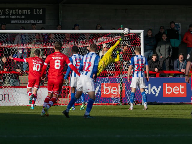 The Pools keeper tips Jack Powell's free kick on to the bar. Crawley Town v Hartlepool United. Pictures by Jamie Evans UK Sports Images SUS-221202-211446004