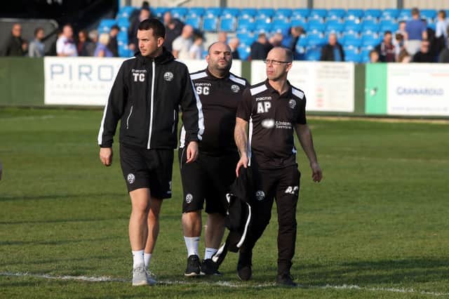 First-team coach Scott Carlin (centre) is staying at AFC Rushden & Diamonds and will help prepare the team for this weekend's game at Biggleswade Town following the departure of Andy Peaks to Tamworth while coach Tom Chapman will join him at the Lambs