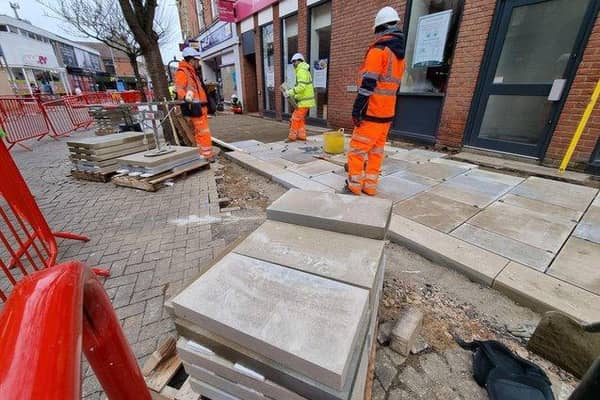 Contractors on-site in Kettering High Street.