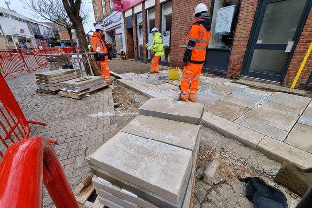 Contractors on-site in Kettering High Street.