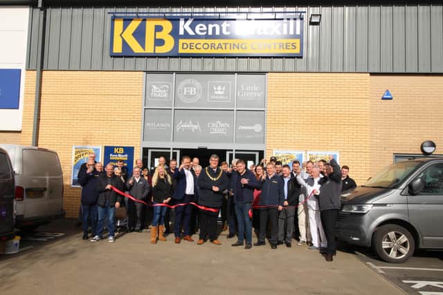 Staff and guests at the new Kettering store including mayor of Kettering, Cllr Scott Edwards, cutting the ribbon. Credit: Kent Blaxill