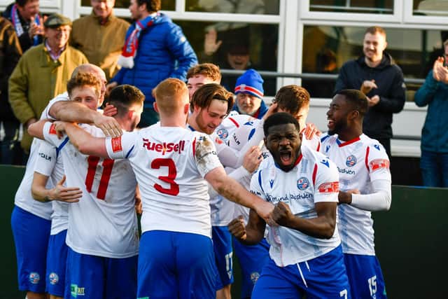 The AFC Rushden & Diamonds players celebrate after captain Alex Collard scored the only goal of the game in the crucial win over Hednesford Town. Picture courtesy of Hawkins Images