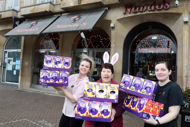 l-r Lorena Kondrova, Jeanette Walsh and Kelly O'Keefe outside Nando's in Northampton, one of the collection points for the Easter egg appeal