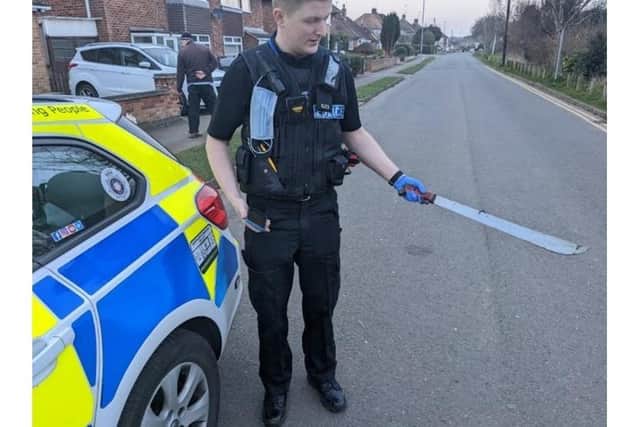 An officer with the machete