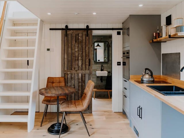 The staircase leads up to the one king-size bed on mezzanine level.
