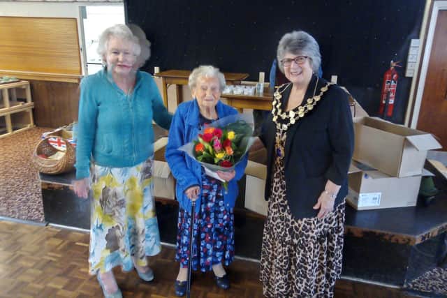 Higham Ferrers mayor Cllr Tina Reavey presented Mrs Gow with a bouquet of roses to mark her 100th birthday