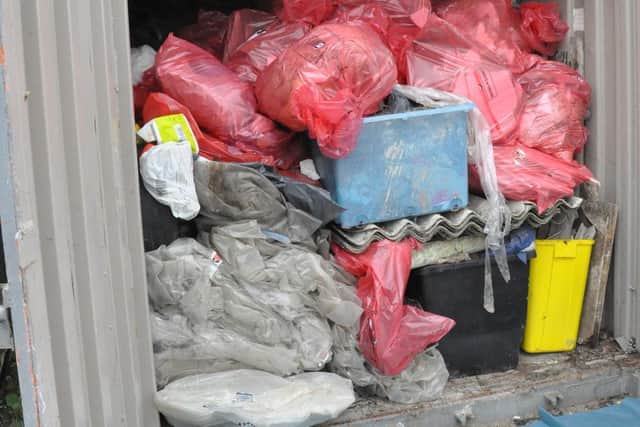 The container was piled high with dangerous asbestos