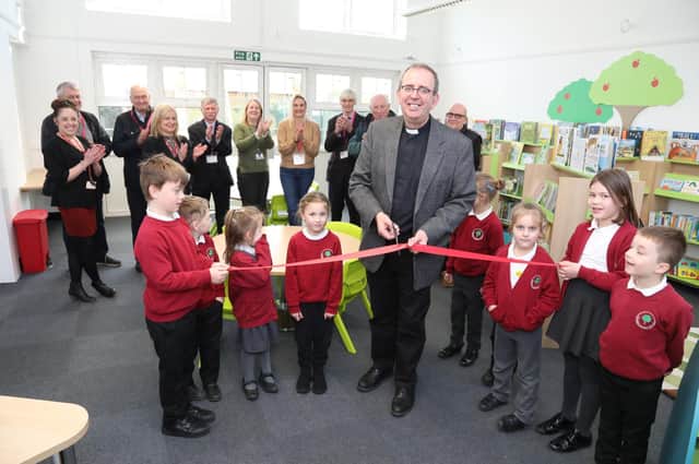 Rev Richard Coles cuts the ribbon on the newly refurbished and re-stocked Finedon Infant School library