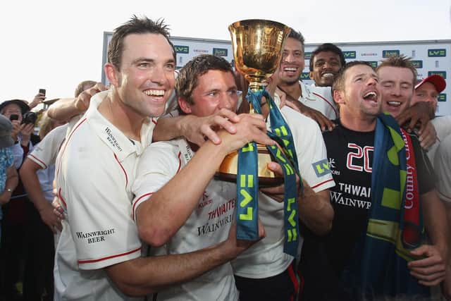 Simon Kerrigan celebrates winning the County Championship title with Lancashire in 2011