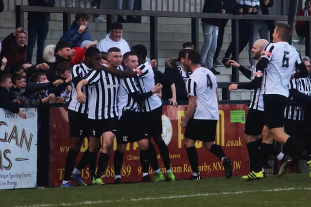 The Corby Town players celebrate Sam Moore's first goal in last weekend's 2-2 draw with Halesowen Town. Picture by David Tilley