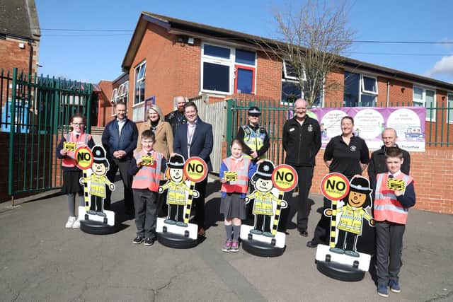 Children from Rothwell Junior School with Keith Millard (senior behavioural change officer), Mayor of Rothwell Cllr Cedwien Brown, PC James Vickery, Ashley Izzard-Snape (executive headteacher) PCSO Kerry York, FF Darren Symons, Claire Neal (crew manager), Ian Boyes (community liaison officer NNC) with Lucy, 9, Joe, 8, Esme, 8, and Joseph, 10.