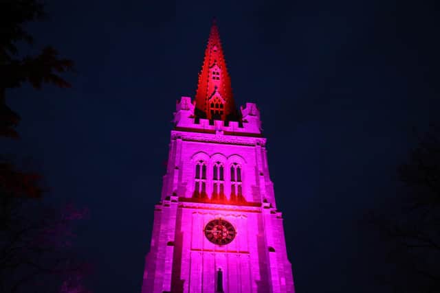 The spire on the parish church of St Peter & St Paul in Kettering was bathed in coloured lights