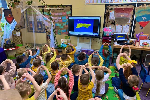 Nene Education Trust children wearing blue and yellow.