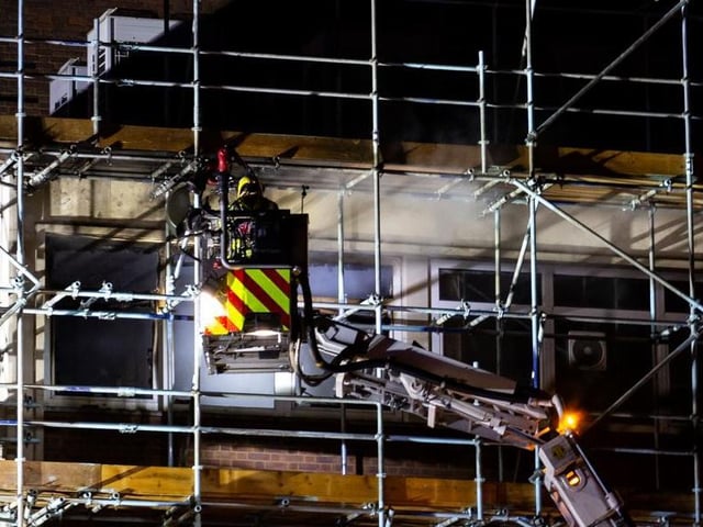 Firefighters used a high-level platform to tackle flames on the fourth floor