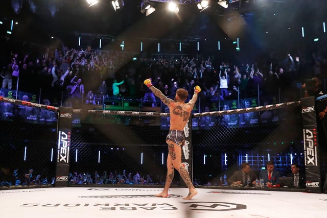 The Corby MMA star takes the applause from the big crowd after his win