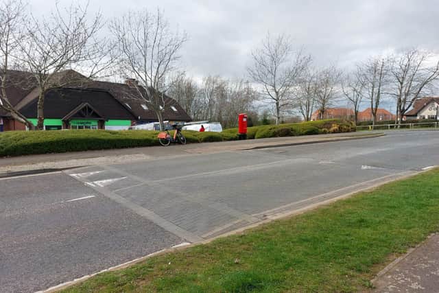 The speed hump is also close to the Bignal Court shops.