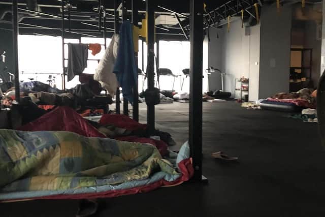 'DIFFER' A gym in Lviv has been turned into a refugee centre. Families sleep on yoga mats and use treadmills to store their few belongings