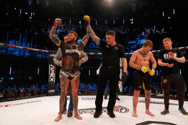 Corby's Jordan Vucenic had his arm raised after he successfully defended his Cage Warriors featherweight title. Picture by Dolly Clew (www.dollyclew.com)