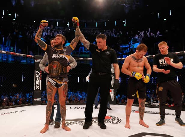 Corby's Jordan Vucenic had his arm raised after he successfully defended his Cage Warriors featherweight title. Picture by Dolly Clew (www.dollyclew.com)