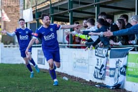 Joe Curtis celebrates with the Corby Town fans after he scored in the 3-1 win at Soham Town Rangers last weekend. Picture by Jim Darrah