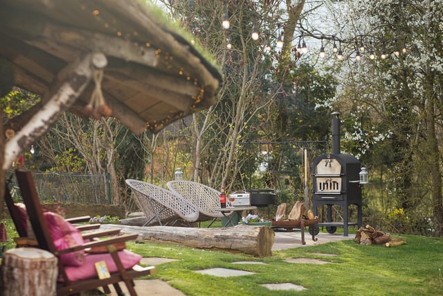 The Hobbit House comes with it's own pizza oven and deckchair space.