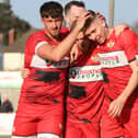 Connor Johnson takes the congratulations after he scored what proved to be the winner in Kettering Town's 2-1 victory over Chorley. Pictures by Peter Short
